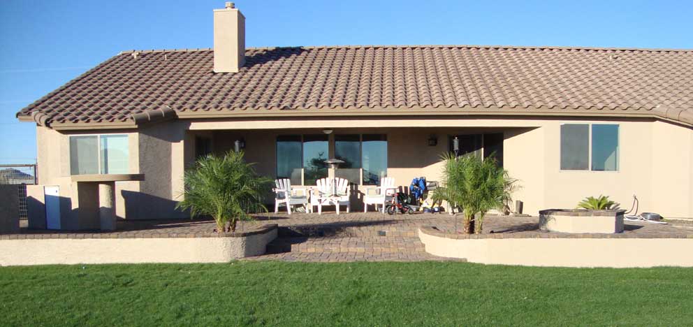 raised paver patio backyard landscape