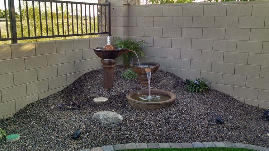 small backyard landscaping with fountain
