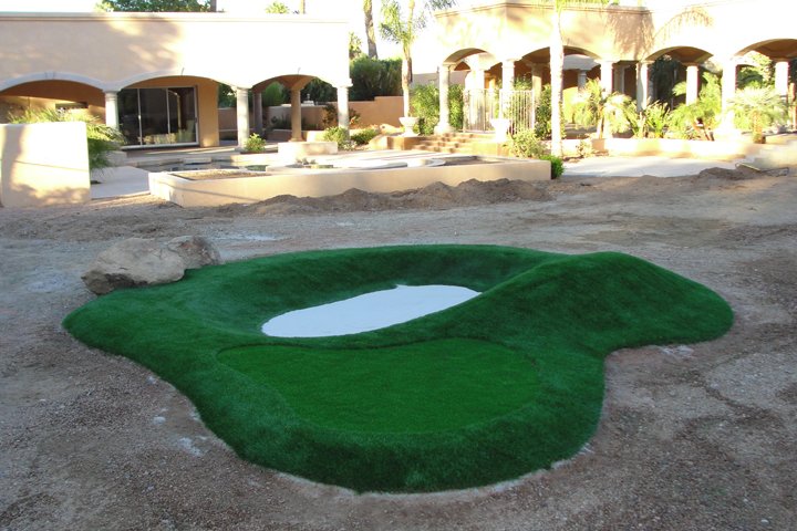 Synthetic putting green with bunker